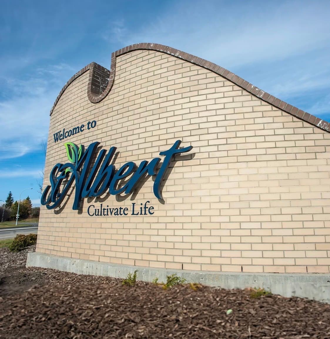 Welcome to St. Albert Cultivate Life landmark sign against a blue sky